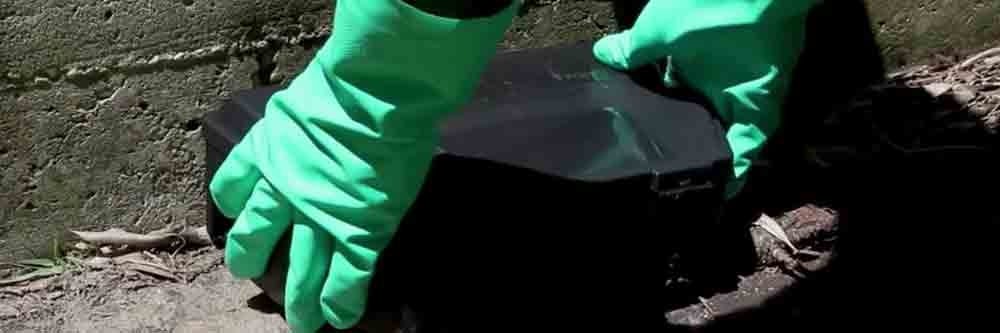 Using gloves for placement of bait station