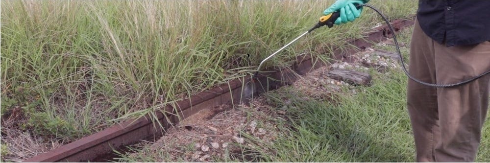 Roundup QuikPro Application Applying RoundUp QuikPro to railroad