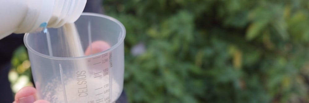 Measuring Celsius WG granules celsius herbicide being poured to measuring cup