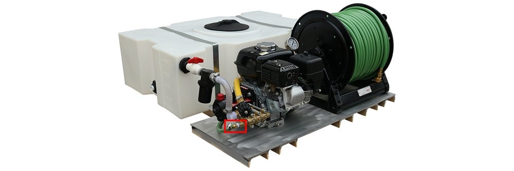 Where the 90 degree hose barb is located as part of the Spraying Rig unit